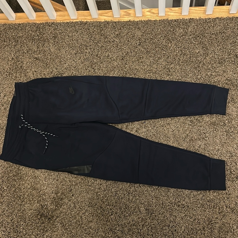 navy blue nike tech pants